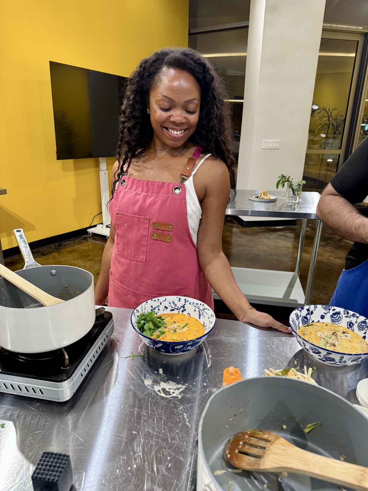 A guest cooking at her station