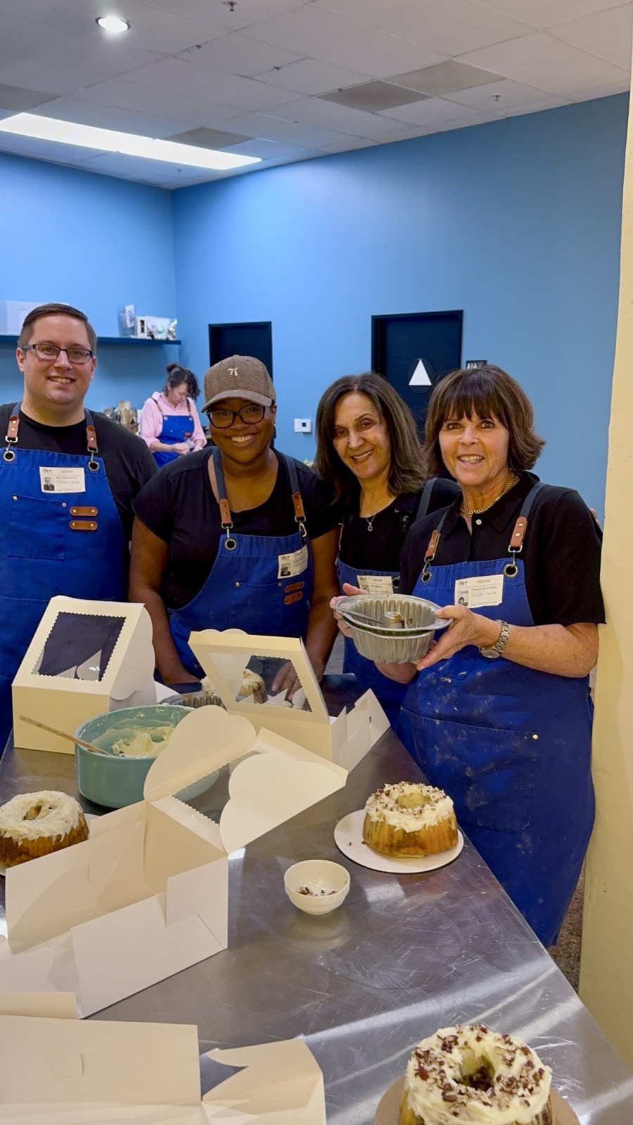 Friends showing off their bundt cakes