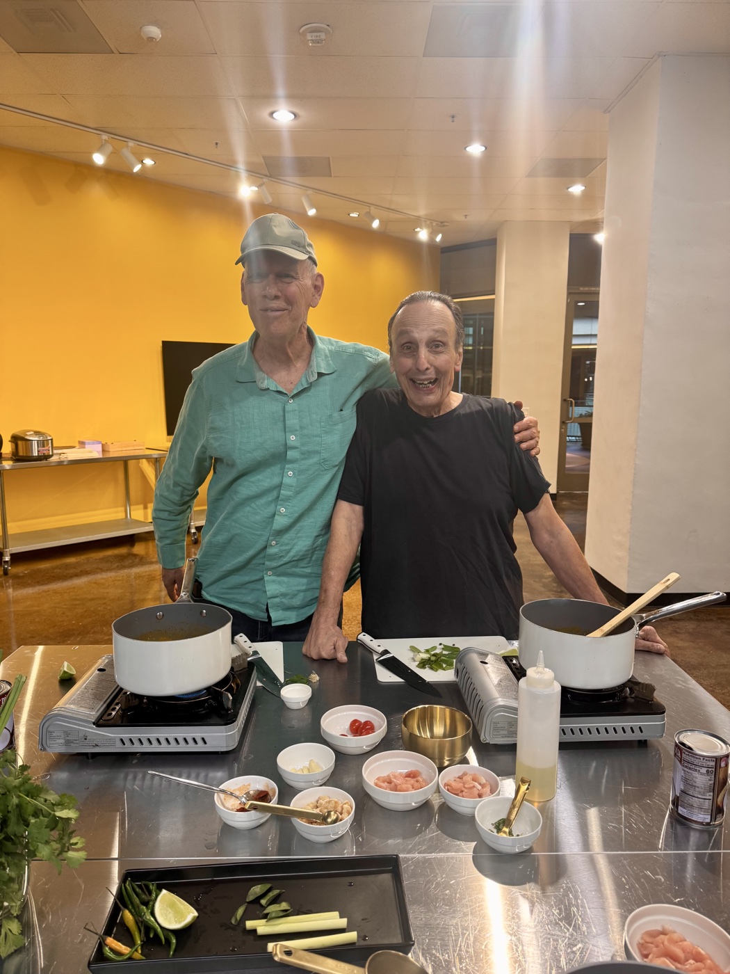 Two guests cooking together