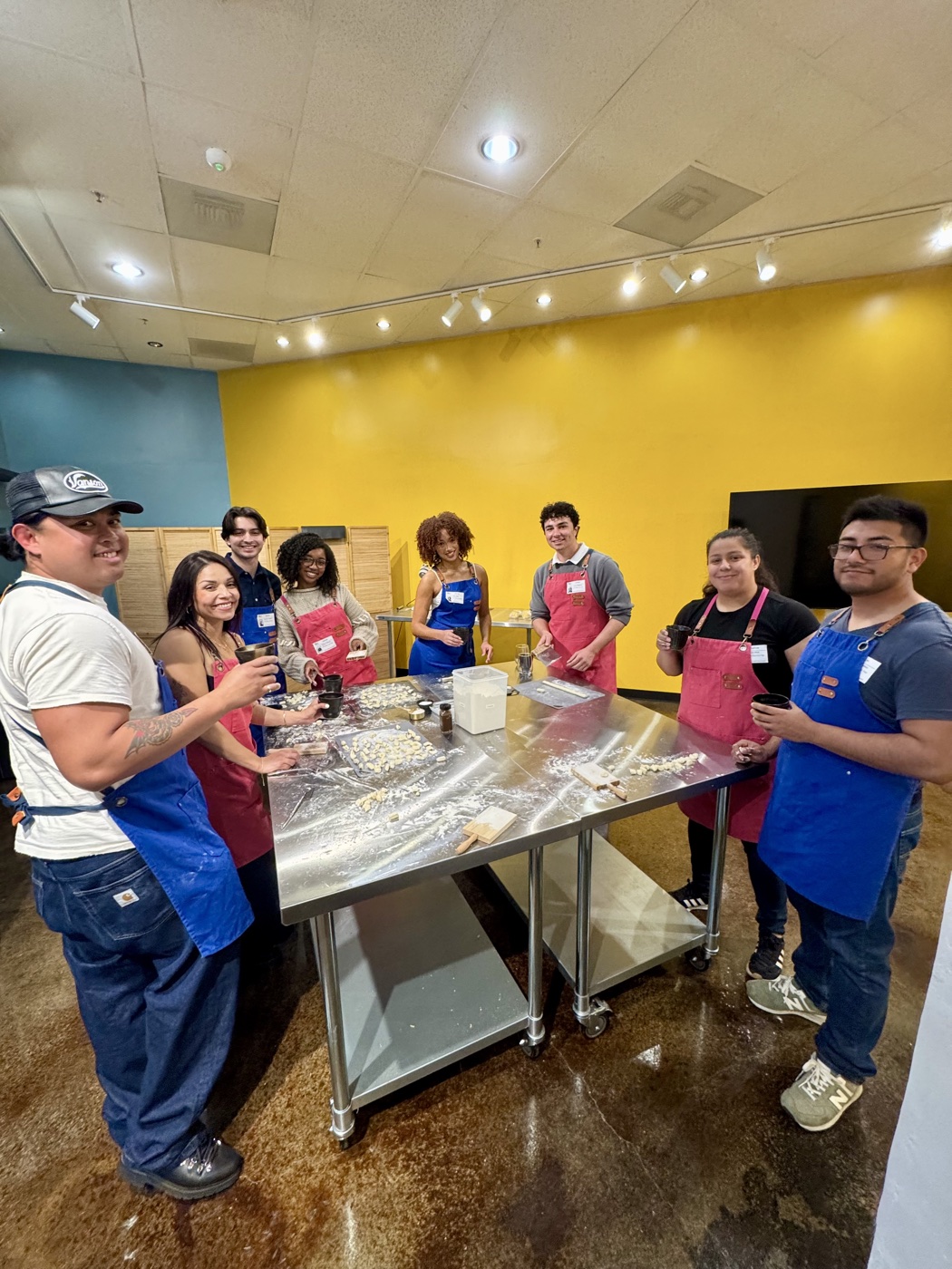 A big group making fresh gnocchi